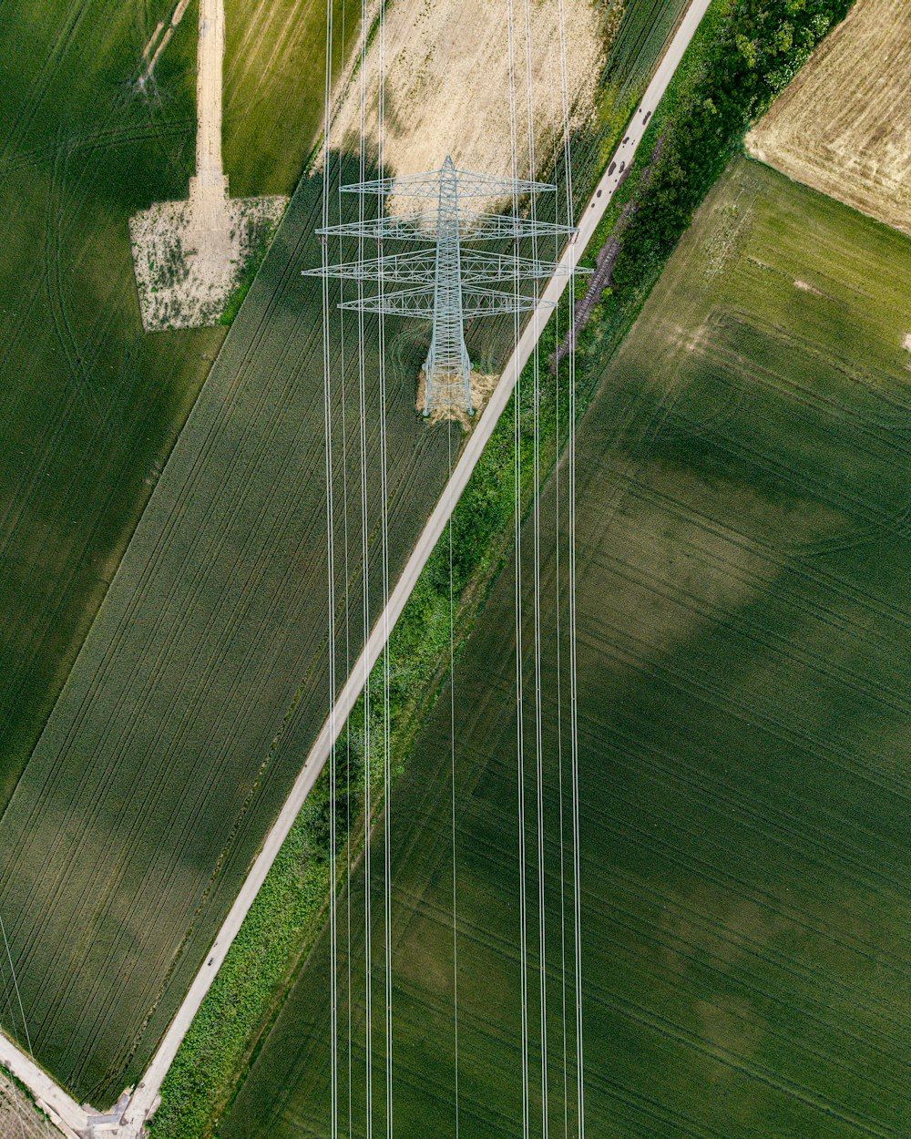 Aerial view of a transmission line across fields